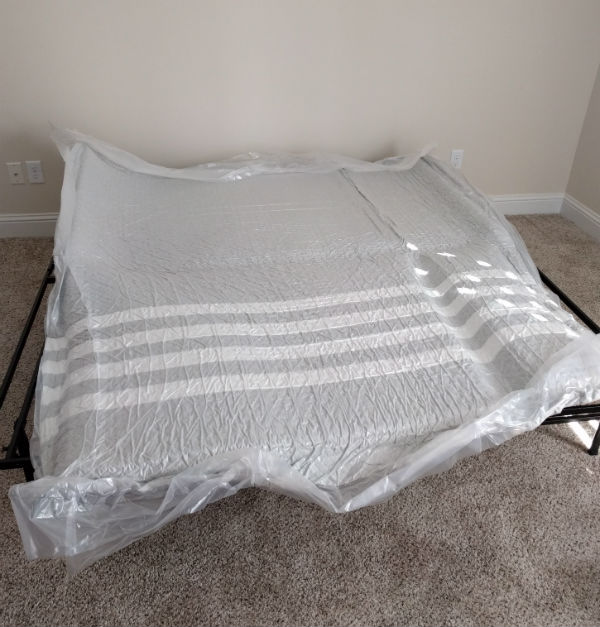 leesa mattress unroll on bedframe